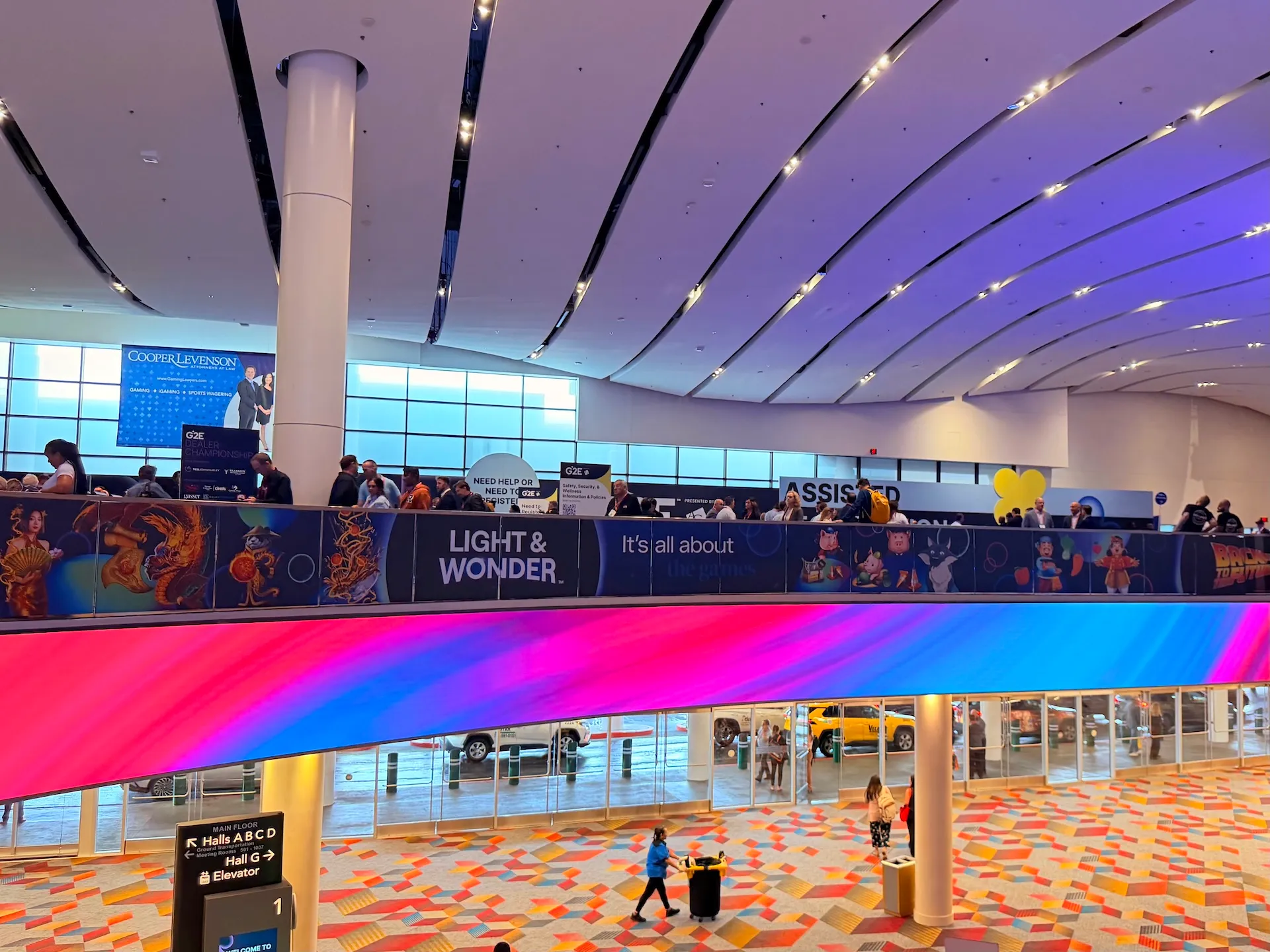 The multi-level grand entrance concourse and digital ribbon display at The Venetian Convention & Expo Center during G2E 2026