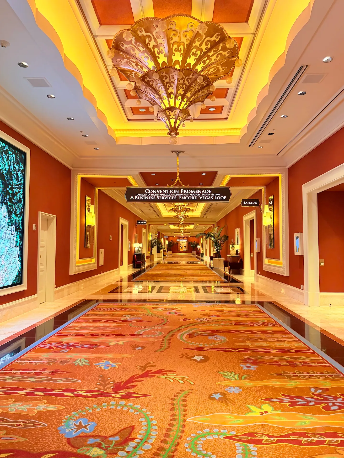The Convention Promenade concourse inside Wynn Las Vegas leading to Business Services, Encore, and the Vegas Loop station
